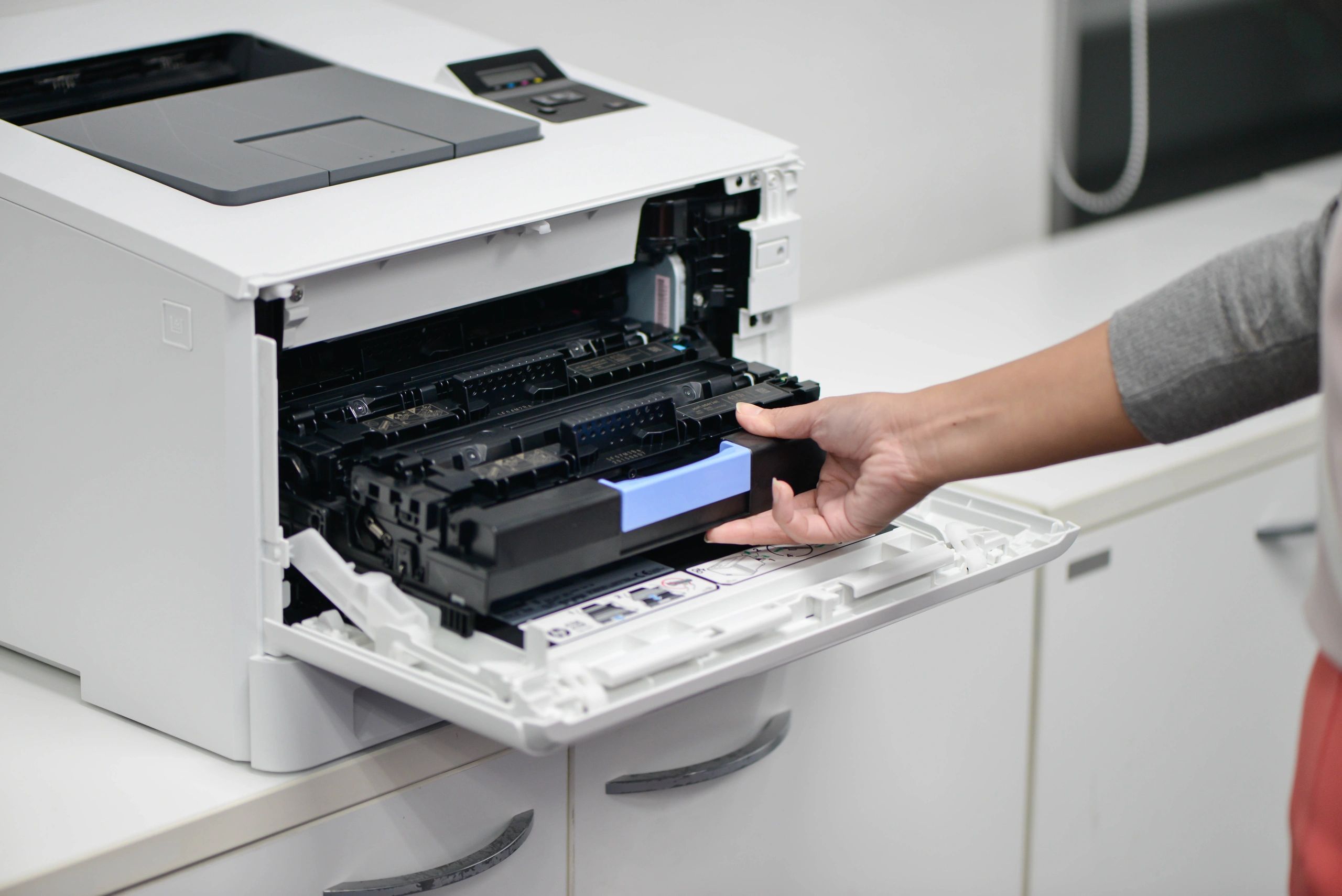 Person operating multifunction office printer